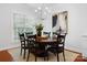 Cozy dining room with traditional furnishings and a large window for natural light at 10205 Alouette Dr, Waxhaw, NC 28173