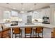 Modern kitchen with a large center island, stainless steel appliances, and pendant lighting at 10205 Alouette Dr, Waxhaw, NC 28173