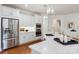 Gourmet kitchen featuring white cabinets, quartz countertops, and stainless steel appliances at 10205 Alouette Dr, Waxhaw, NC 28173