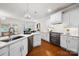 Spacious kitchen featuring stainless steel appliances, white cabinets, and open layout to dining area at 10205 Alouette Dr, Waxhaw, NC 28173