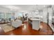 Open-concept living space with hardwood floors, a modern kitchen, and comfortable seating at 10205 Alouette Dr, Waxhaw, NC 28173