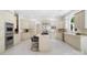 Bright kitchen features light cabinetry, stainless steel appliances, a center island, and eat-in bar seating at 1245 Bellemeade Ln, Charlotte, NC 28270