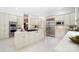 Spacious kitchen featuring stainless steel appliances, custom cabinetry, and a large center island with gas cooktop at 1245 Bellemeade Ln, Charlotte, NC 28270