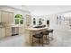 Bright, open kitchen with a large island, stainless steel appliances and a dining area filled with natural light at 1245 Bellemeade Ln, Charlotte, NC 28270