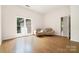 Bright and airy living room with natural light and beautiful hardwood floors at 1245 Bellemeade Ln, Charlotte, NC 28270