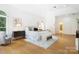Bright main bedroom featuring a large window, sitting area, and ensuite bathroom access at 1245 Bellemeade Ln, Charlotte, NC 28270