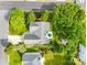 Aerial view of a landscaped property with a patio, shed, mature trees, and a well-maintained lawn at 1301 Cool Mist Ct, Indian Land, SC 29707