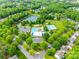 Aerial view of the community with a pool, tennis courts, pond, playground, and clubhouse at 1301 Cool Mist Ct, Indian Land, SC 29707