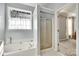 Relaxing bathroom with a soaking tub, separate shower, and natural light at 1301 Cool Mist Ct, Indian Land, SC 29707
