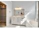 Bright bathroom featuring double vanity, marble countertops, and ample storage at 1301 Cool Mist Ct, Indian Land, SC 29707