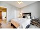 Bedroom featuring a queen-sized bed, neutral walls, ceiling fan, closet with white doors and a light fixture at 1301 Cool Mist Ct, Indian Land, SC 29707