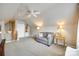 Bright and airy bonus room with a loveseat, lamps, and ceiling fan, perfect for relaxing or entertaining at 1301 Cool Mist Ct, Indian Land, SC 29707