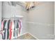 A well-organized closet with wire shelving and hanging clothes provides ample storage space at 1301 Cool Mist Ct, Indian Land, SC 29707