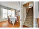 Formal dining room with hardwood floors, a dining table set for six, and a staircase at 1301 Cool Mist Ct, Indian Land, SC 29707