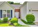 Close up of the well maintained front yard and white front door at 1301 Cool Mist Ct, Indian Land, SC 29707