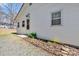 Fresh exterior with white siding and a garden along the side providing an eye-catching aesthetic at 1339 Hill St, Albemarle, NC 28001