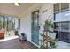Charming front porch featuring wood floors, potted plants, and a blue front door at 1339 Hill St, Albemarle, NC 28001