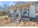 Charming home featuring a covered front porch with gray painted railings and stairs at 1339 Hill St, Albemarle, NC 28001