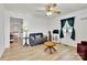 Inviting living room with light wood floors, comfortable seating, and plenty of natural light at 1339 Hill St, Albemarle, NC 28001