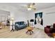Bright living room with hardwood floors, comfortable seating, and a ceiling fan at 1339 Hill St, Albemarle, NC 28001