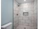 This bathroom features an updated shower with white subway tile and a rainfall shower head at 1428 E Main St, Cherryville, NC 28021