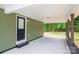 Covered carport area with access door and ample parking space at 1428 E Main St, Cherryville, NC 28021
