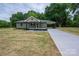 Charming single-story home with a welcoming front yard and a convenient carport at 1428 E Main St, Cherryville, NC 28021