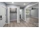The living room features hardwood floors and views to the laundry room and a bedroom at 1428 E Main St, Cherryville, NC 28021