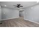 The living room features hardwood floors and multiple windows for lots of natural light at 1428 E Main St, Cherryville, NC 28021