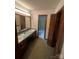 Double vanity bathroom with linoleum floors, lots of room, and natural light at 1502 Shelby Hwy, Cherryville, NC 28021