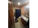 Functional bathroom with a tub/shower combination, single sink vanity, and neutral finishes at 1502 Shelby Hwy, Cherryville, NC 28021