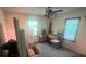 Bedroom with a ceiling fan, windows, and carpeted floors at 1502 Shelby Hwy, Cherryville, NC 28021