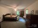 Spacious bedroom with carpet, ceiling fan, and natural light at 1502 Shelby Hwy, Cherryville, NC 28021