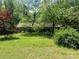 Exterior with luscious green trees, well maintained yard, and lots of shade at 1502 Shelby Hwy, Cherryville, NC 28021