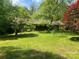 Charming home exterior with a lush, landscaped front yard at 1502 Shelby Hwy, Cherryville, NC 28021