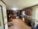 Well-lit kitchen featuring dark wood cabinetry, modern appliances, and neutral-toned flooring at 1502 Shelby Hwy, Cherryville, NC 28021