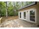Spacious wooden back deck with natural wood and trees in background at 1513 White Ridge Dr, Rock Hill, SC 29732