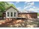 A brick and vinyl exterior with a small deck in the backyard at 1513 White Ridge Dr, Rock Hill, SC 29732