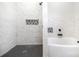 Modern bathroom features tiled shower, soaking tub, and decorative tiled niche at 1513 White Ridge Dr, Rock Hill, SC 29732