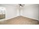 Spacious bedroom features an adjacent bathroom with stylish vanity and vinyl flooring, lots of light at 1513 White Ridge Dr, Rock Hill, SC 29732