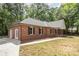 A beautiful brick house with a mix of classic and modern design, complemented by a well-kept lawn at 1513 White Ridge Dr, Rock Hill, SC 29732