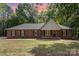 Charming brick home with a classic design and a well-manicured lawn at 1513 White Ridge Dr, Rock Hill, SC 29732