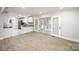 Open kitchen with white cabinetry, stainless steel appliances, and modern countertops, seamlessly connected to living space at 1513 White Ridge Dr, Rock Hill, SC 29732