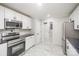Bright kitchen features white cabinets, black countertops, stainless steel appliances, and modern finishes at 1513 White Ridge Dr, Rock Hill, SC 29732