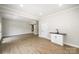 Spacious living room with hardwood floors, utility sink, and sliding barn closet doors at 1513 White Ridge Dr, Rock Hill, SC 29732