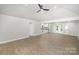 Bright and spacious living room with modern flooring, high ceiling, and neutral paint, leading to outdoor access at 1513 White Ridge Dr, Rock Hill, SC 29732