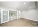 Bright sunroom with abundant natural light through the glass doors and windows, offering a serene indoor-outdoor experience at 1513 White Ridge Dr, Rock Hill, SC 29732