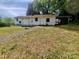 Exterior back of the home with some grassy space at 16603 Nc Hwy 73 Hwy, Albemarle, NC 28001