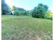 Expansive backyard with mature trees and lush greenery surrounding the property at 16603 Nc Hwy 73 Hwy, Albemarle, NC 28001