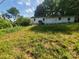 The backyard of the home with grass and foliage at 16603 Nc Hwy 73 Hwy, Albemarle, NC 28001
